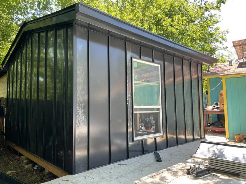 Black standing seam metal wall panels for Metal Roof Installation in Pontiac